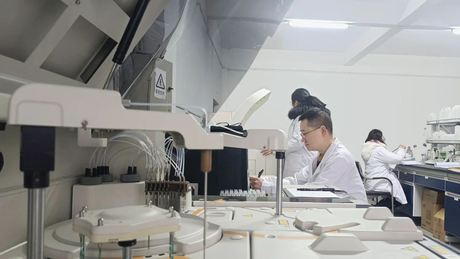 BIOLOT team working with laboratory analyzers at the Wuhan R&D laboratory